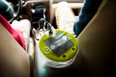 Collapsed lantern on in car with USB cable attached