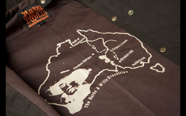 Brown | Burke & Wills Balranald Full Length Oilskin Coat. Internal Lining View of Burke and Wills Expedition Map. Your Outdoor Store