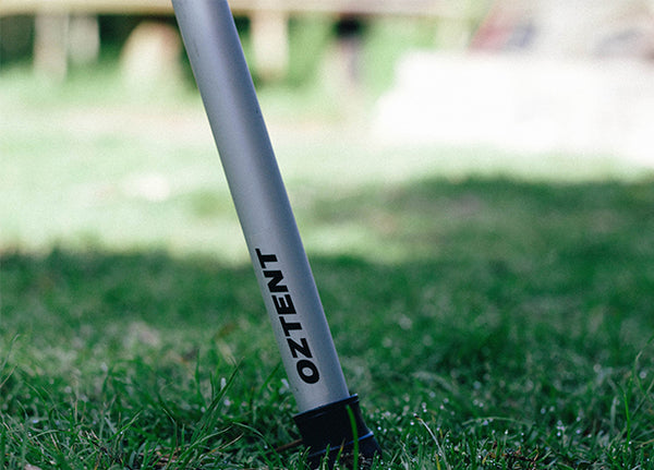 Oztent Aluminium Telescopic Spreader Pole. Pictured on grass. 