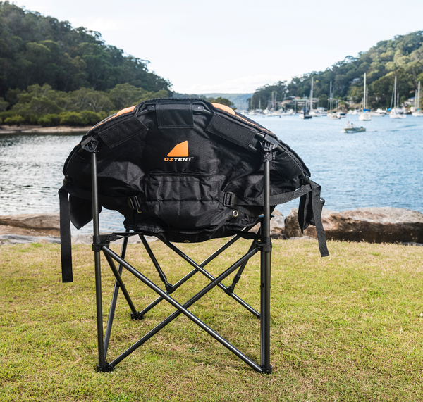 Back of the chair next to a body of water