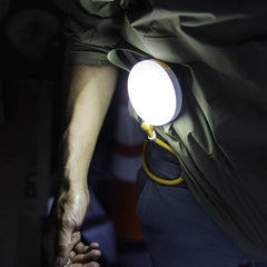 light in use with adjustable arm wrapped through belt loops for hands free use
