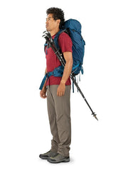 Black | Pack Worn with trekking poles attached, side view