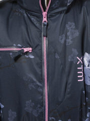 Navy Floral | XTM Akira Kids Snow Suit. Modeled Close up View of the breast pocket and front zip. Your Outdoor Store