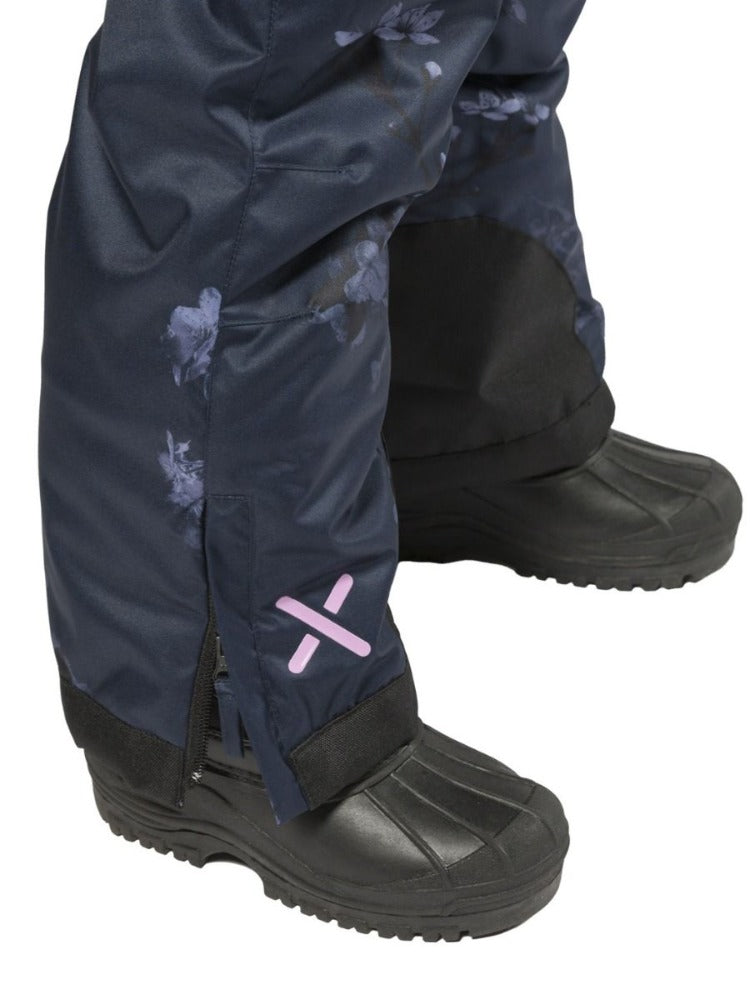 Navy Floral | XTM Akira Kids Snow Suit. Modeled Close up View of the lower leg and ankle with boots on. Your Outdoor Store
